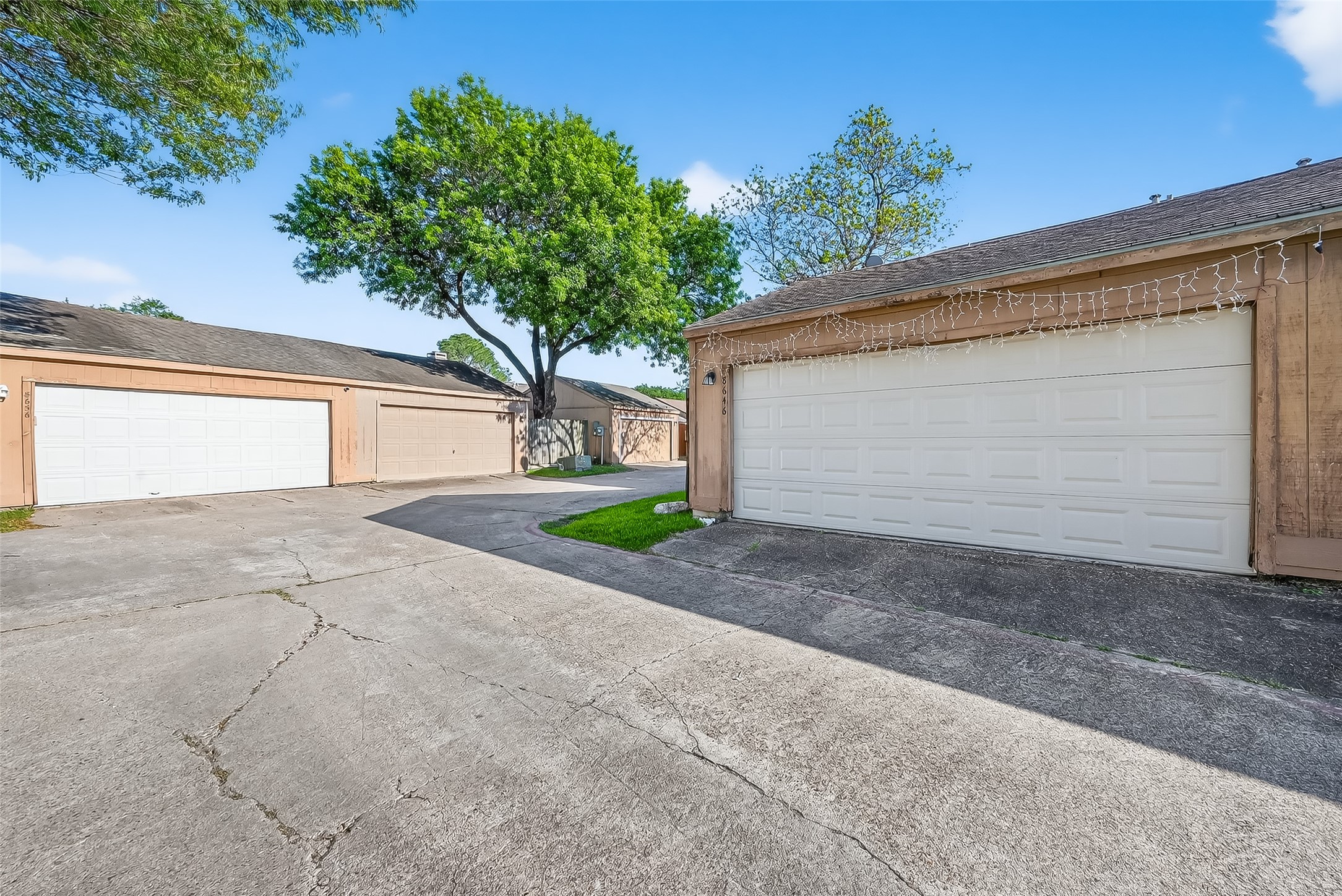 8646 Maplecrest Drive Houston, TX 77099 - Photo 36 of 36 a front view of a house with a yard and garage