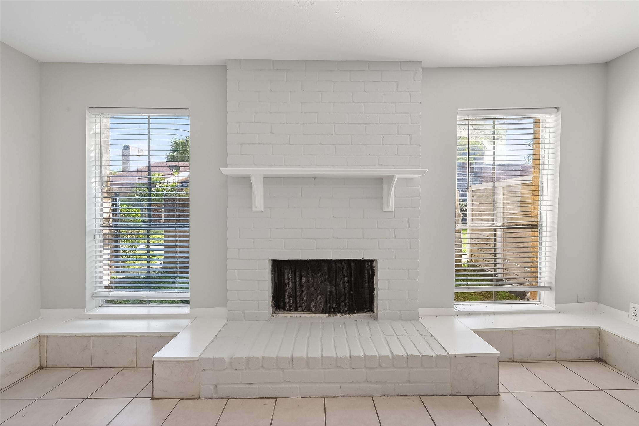 8646 Maplecrest Drive Houston, TX 77099 - Photo 10 of 36 a living room with a large window and a fireplace