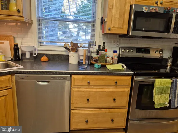a kitchen with a stove and a microwave