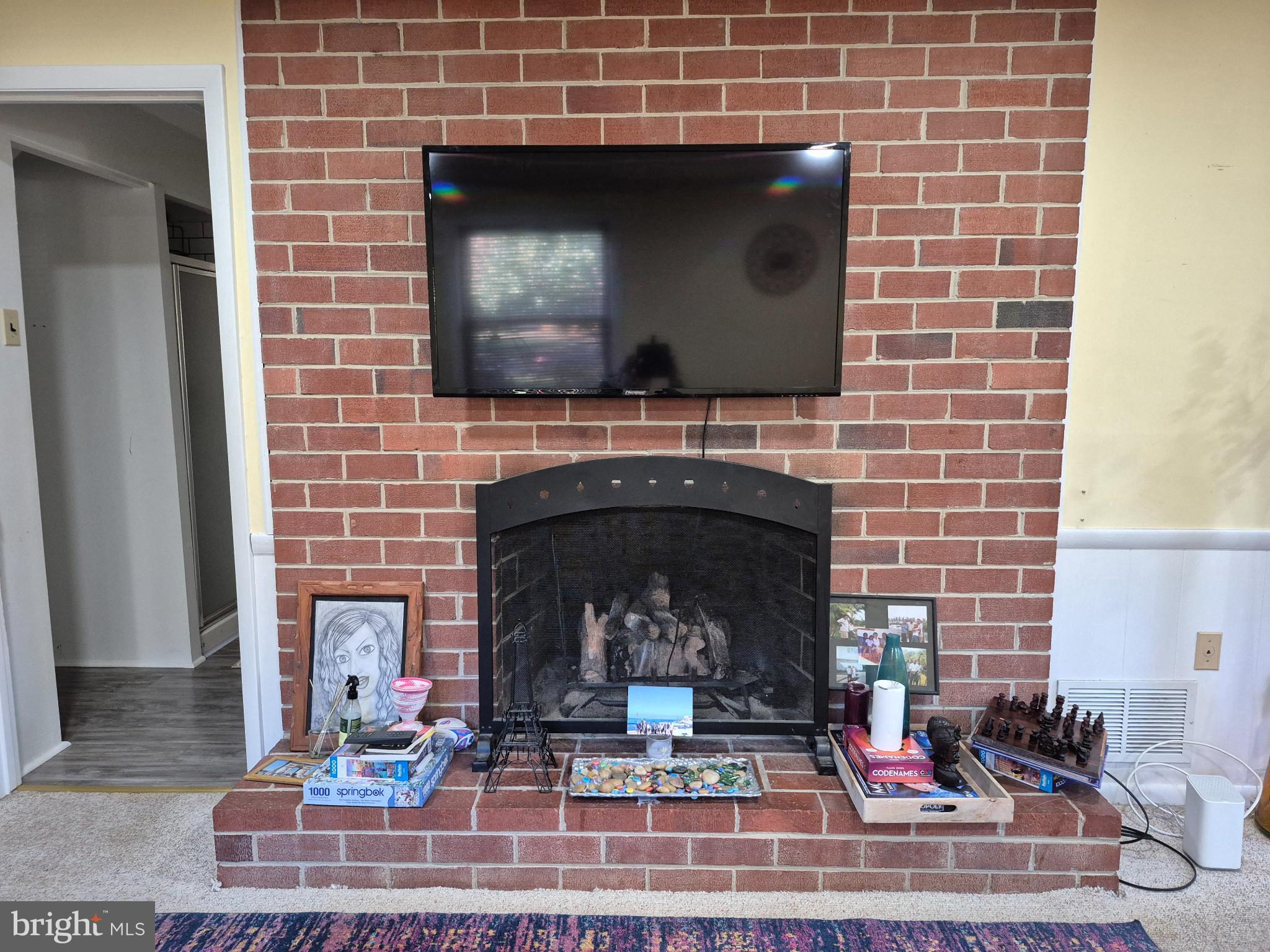 12512 Ofallon Street Silver Spring, MD 20904 - Photo 29 of 44 a living room with a fireplace and a fireplace