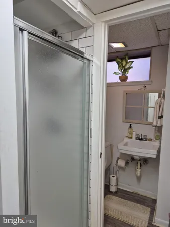a bathroom with a sink mirror and vanity