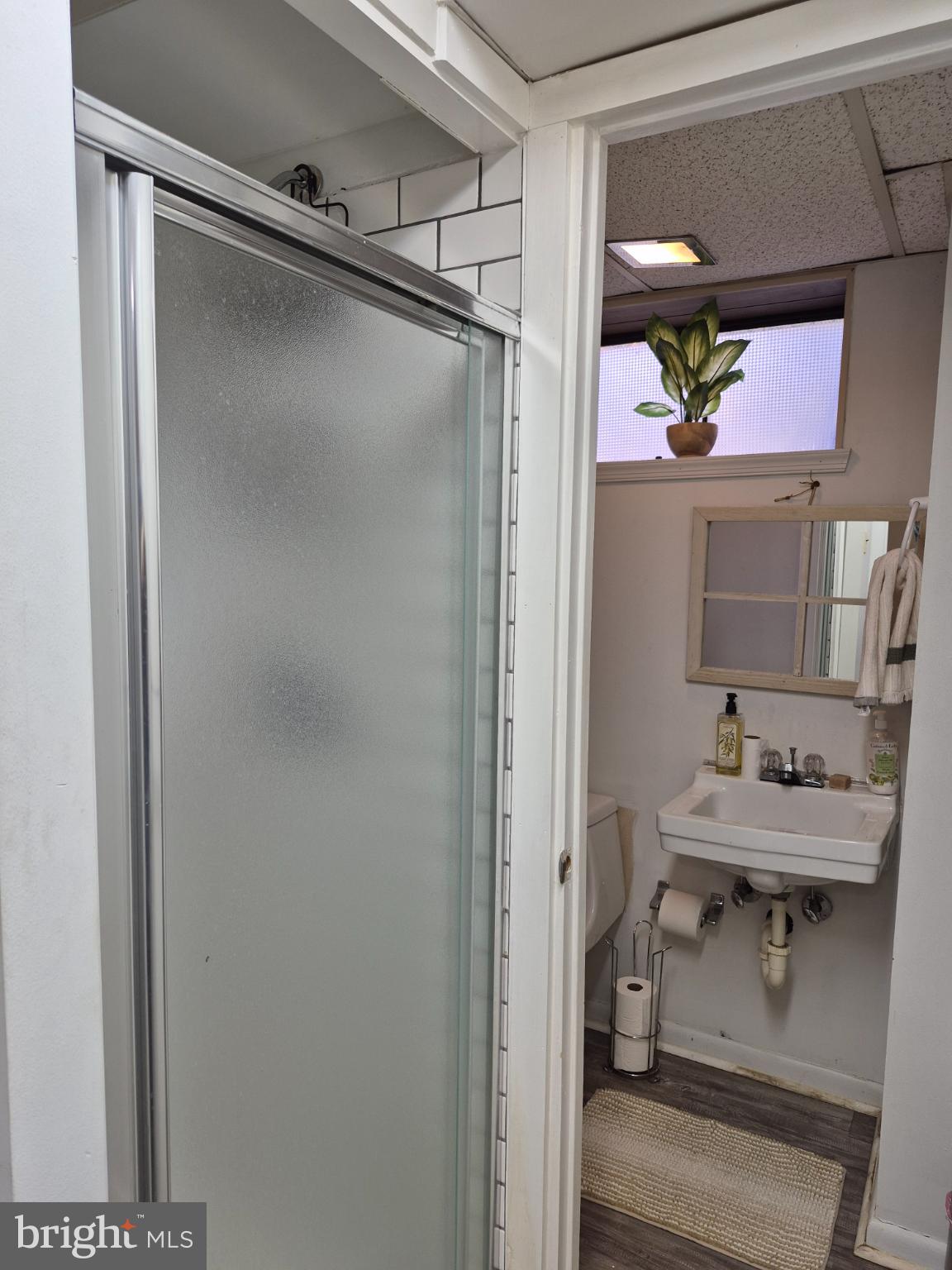 12512 Ofallon Street Silver Spring, MD 20904 - Photo 32 of 44 a bathroom with a sink mirror and vanity
