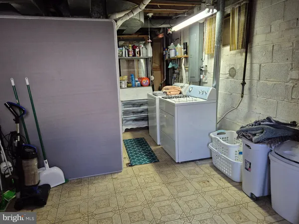 a kitchen with a stove and a refrigerator