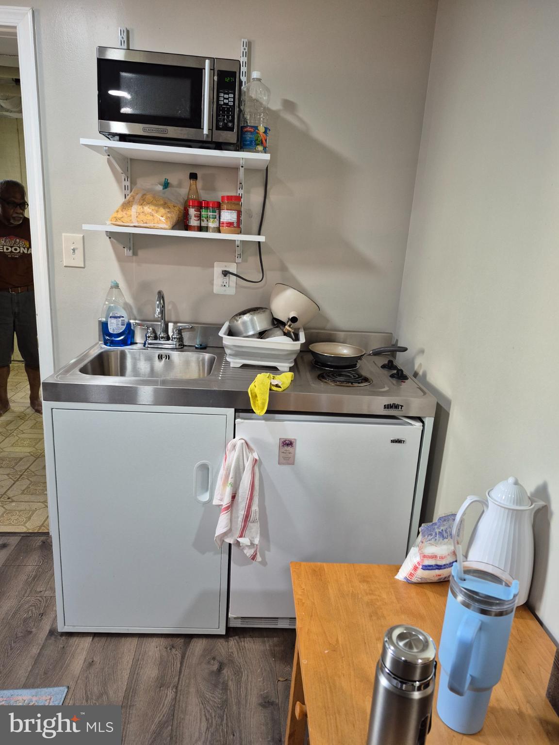 12512 Ofallon Street Silver Spring, MD 20904 - Photo 37 of 44 a kitchen with stainless steel appliances granite countertop a sink and a microwave