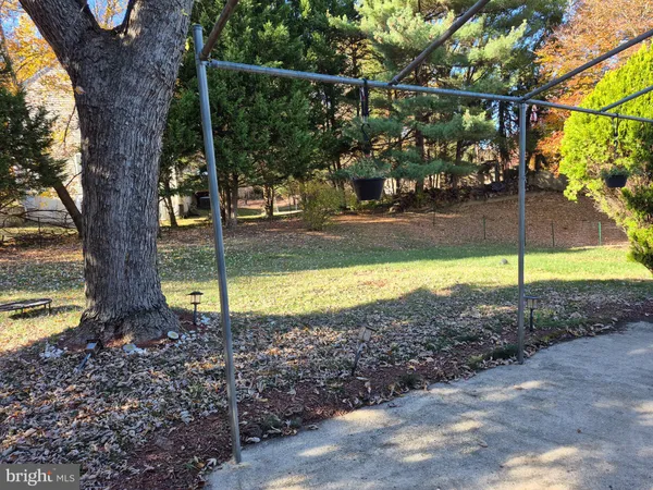 a view of a yard with swimming pool