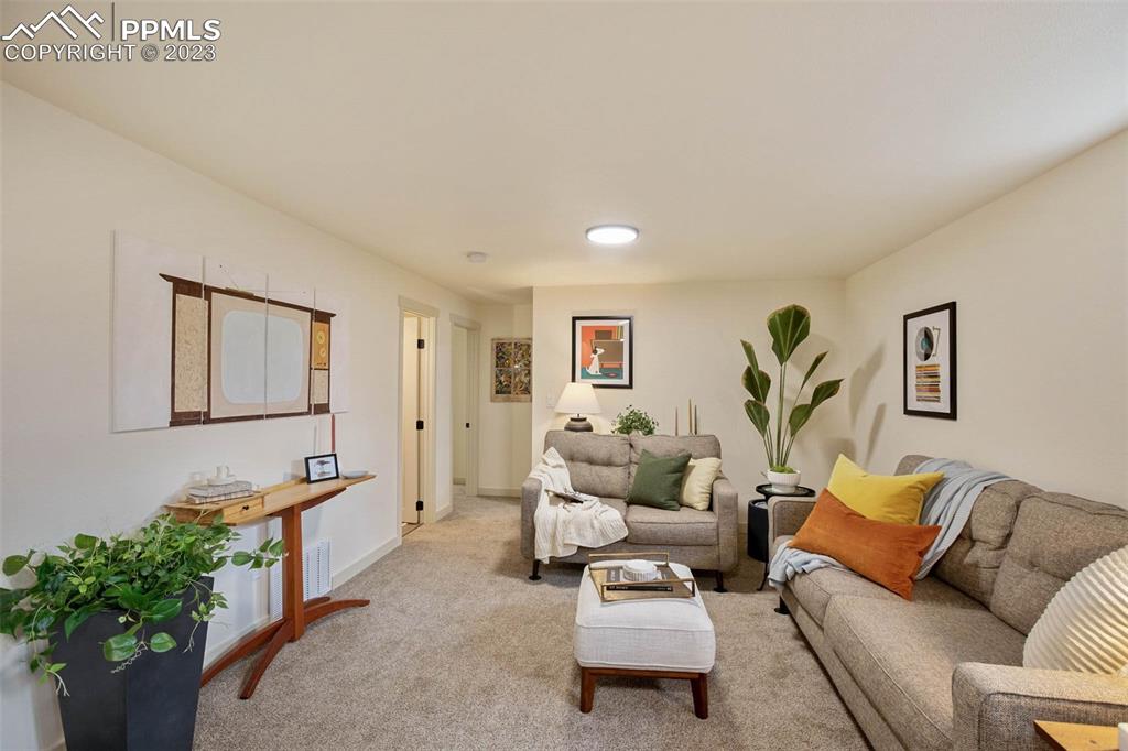 2415 Monterey Road Colorado Springs, CO 80910 - Photo 21 of 36 a living room with furniture and flowers