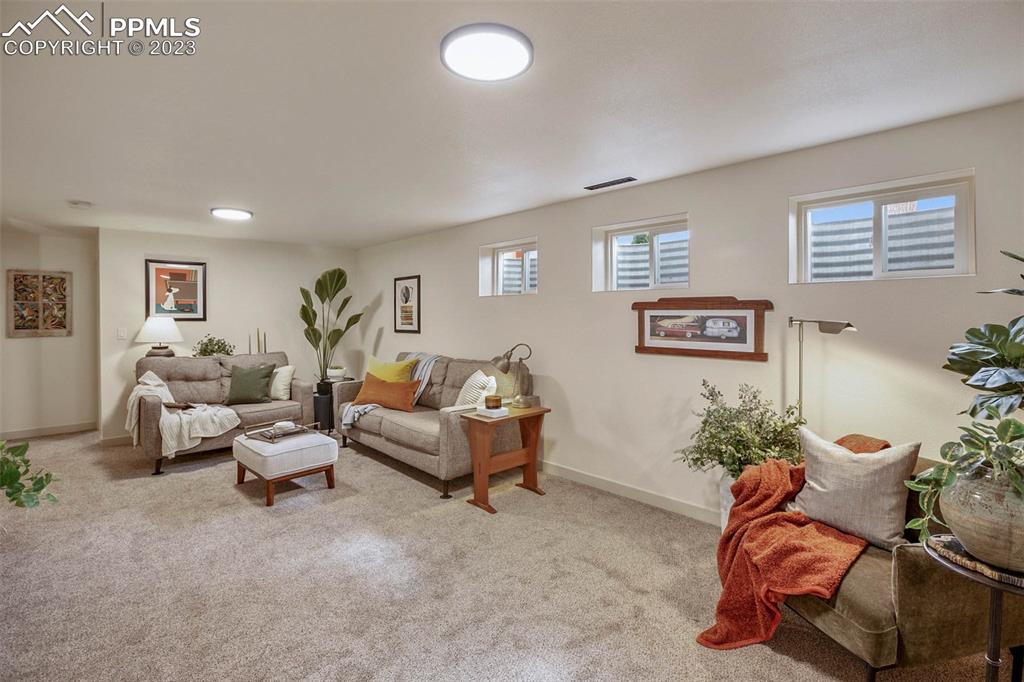 2415 Monterey Road Colorado Springs, CO 80910 - Photo 22 of 36 a living room with furniture flowerpot and window