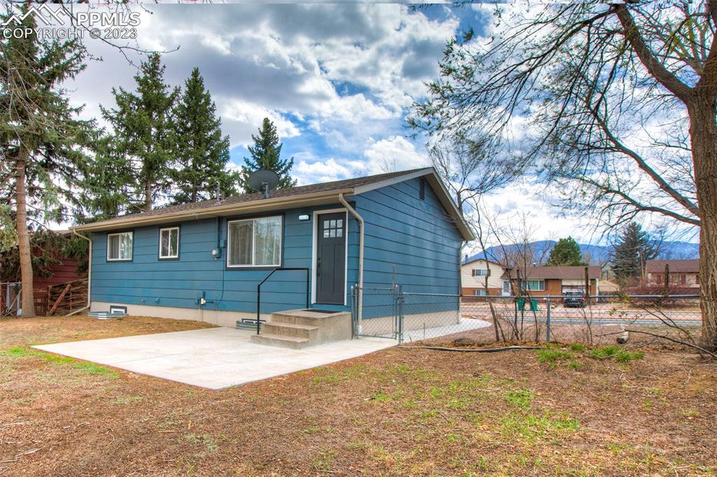 2415 Monterey Road Colorado Springs, CO 80910 - Photo 34 of 36 a backyard of a house with table and chairs