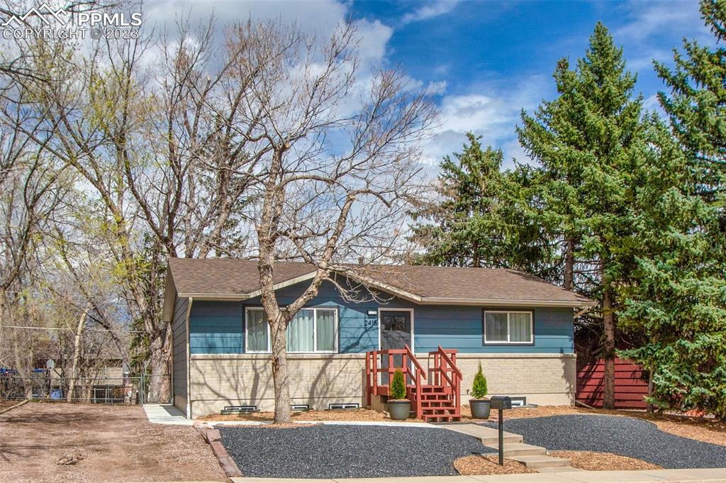 2415 Monterey Road Colorado Springs, CO 80910 - Photo 35 of 36 front view of house with a yard