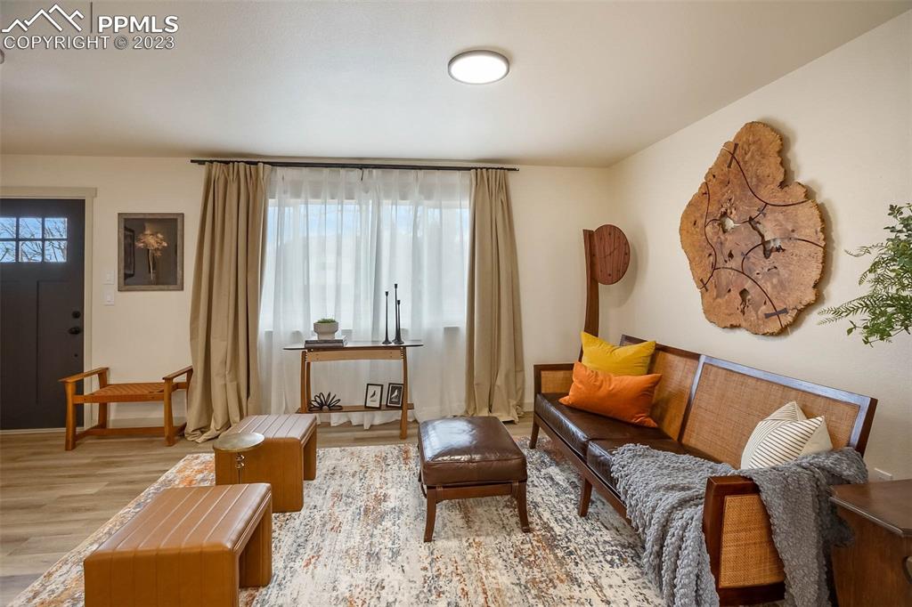 2415 Monterey Road Colorado Springs, CO 80910 - Photo 4 of 36 a living room with furniture and a large window