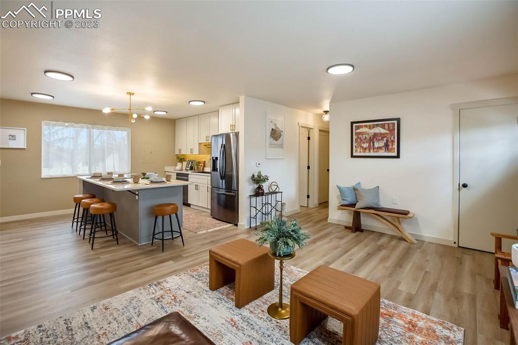 2415 Monterey Road Colorado Springs, CO 80910 - Photo 10 of 36 a living room with furniture and kitchen view