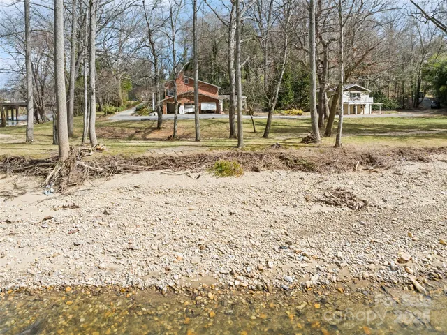 a backyard of a house with large trees