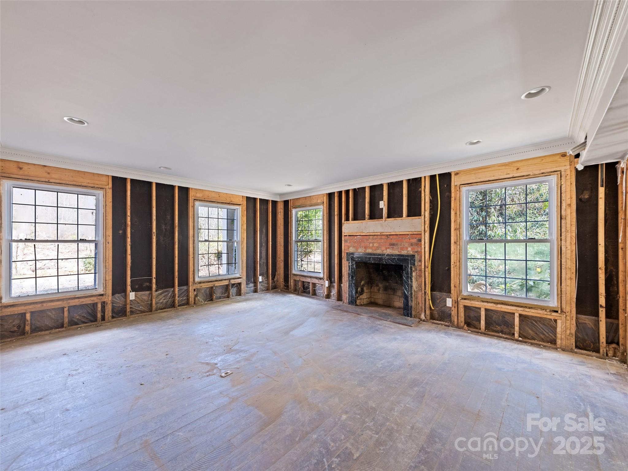21 Riverbend Street Canton, NC 28716 - Photo 25 of 47 a view of an empty room with a fireplace and a window