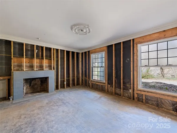 a view of staircase with wooden floor and a rug