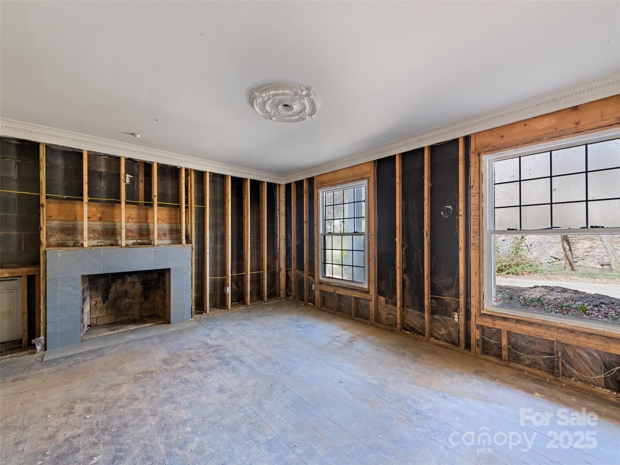 21 Riverbend Street Canton, NC 28716 - Photo 34 of 47 an empty room with furniture and a fireplace