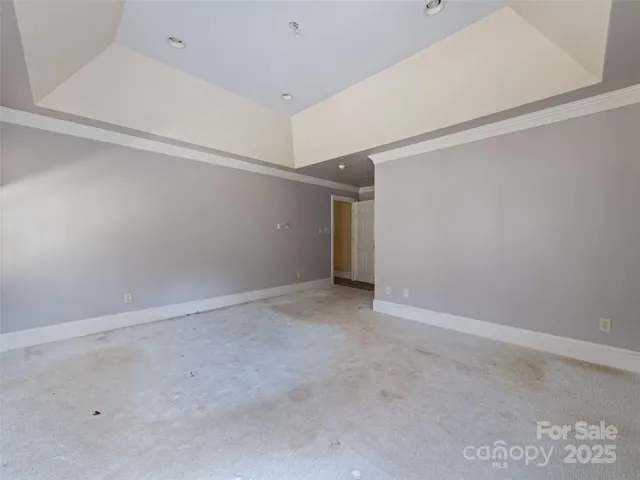a bathroom with a granite countertop sink and a large mirror