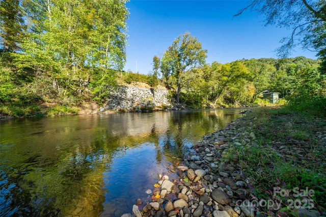 a view of a lake with a house in the background
