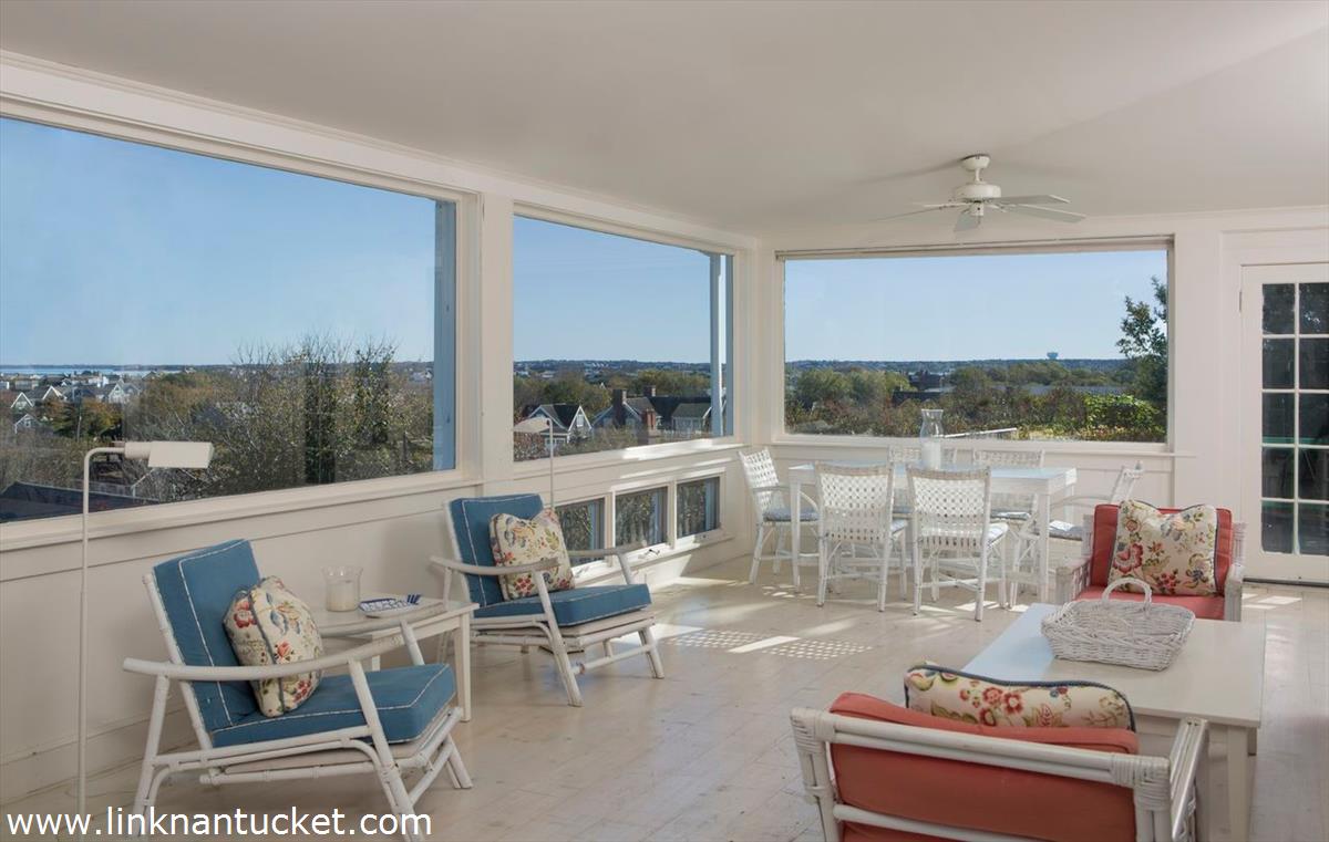 47 Cliff Road Nantucket, MA 02554 - Photo 17 of 22 a living room with furniture and a floor to ceiling window