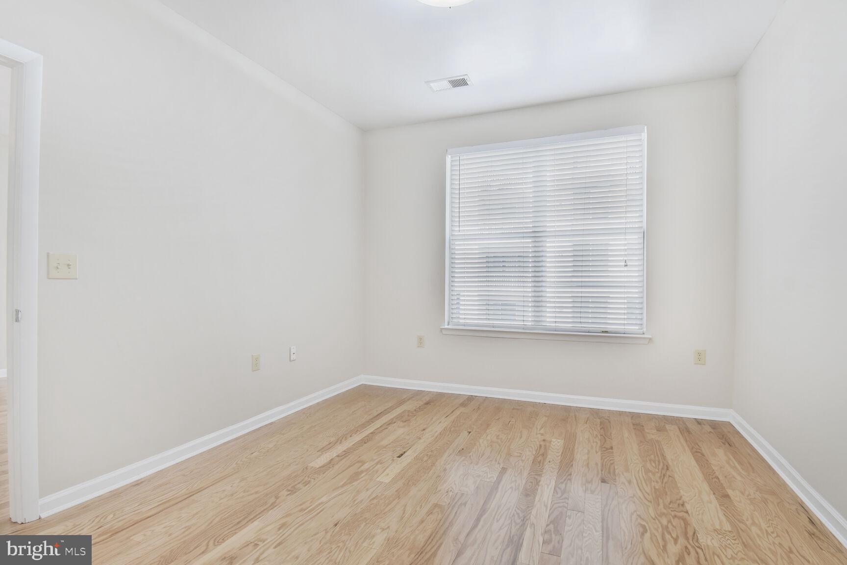 1201 East-West Highway, Unit 331 Silver Spring, MD 20910 - Photo 15 of 34 an empty room with a window