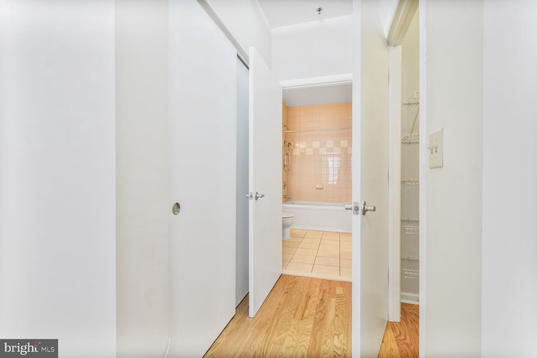 1201 East-West Highway, Unit 331 Silver Spring, MD 20910 - Photo 19 of 34 a view of a bedroom from a hallway