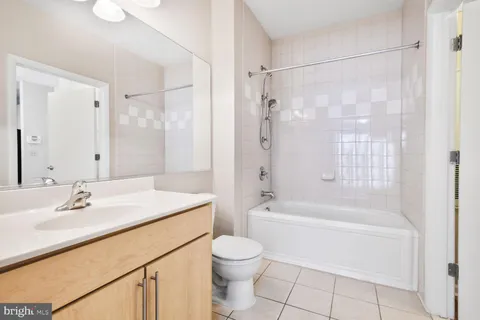 a picture of a park with a bench and a picture on the wall