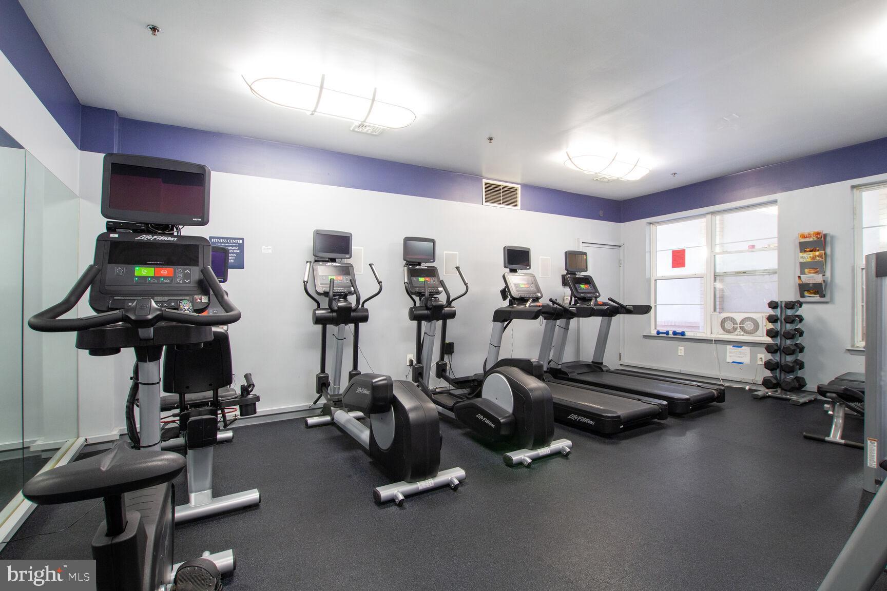 1201 East-West Highway, Unit 331 Silver Spring, MD 20910 - Photo 27 of 34 a view of a room with gym equipment