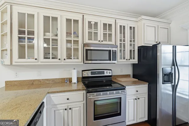 a bathroom with a sink a toilet and curtain