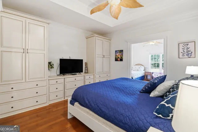 a bedroom with a large bed and a lamp