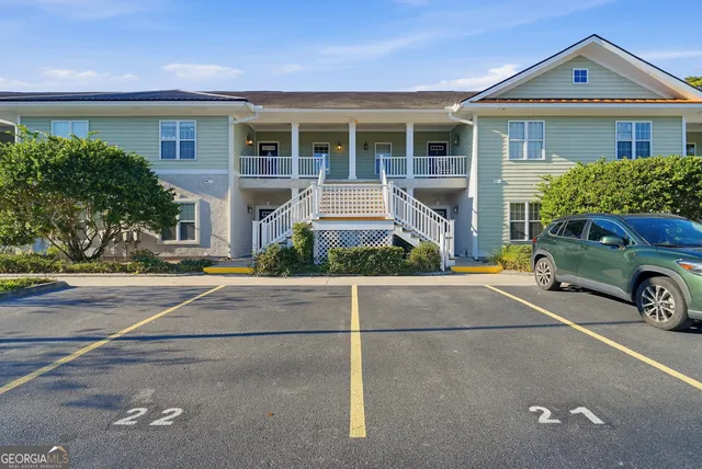 a front view of a house with garage
