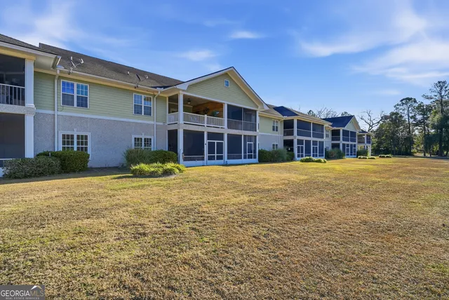 a view of a park with large trees