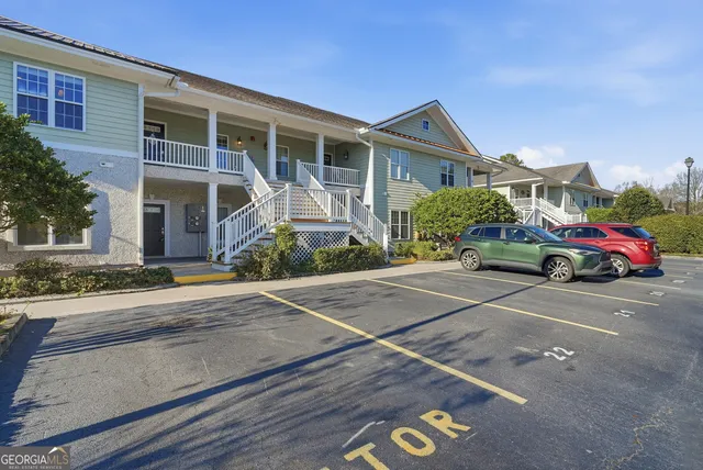 front view of a house with car parked