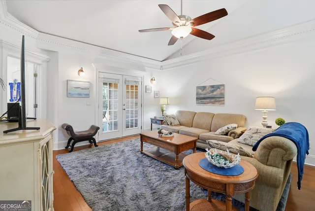 a view of a dining room with furniture wooden floor and chandelier