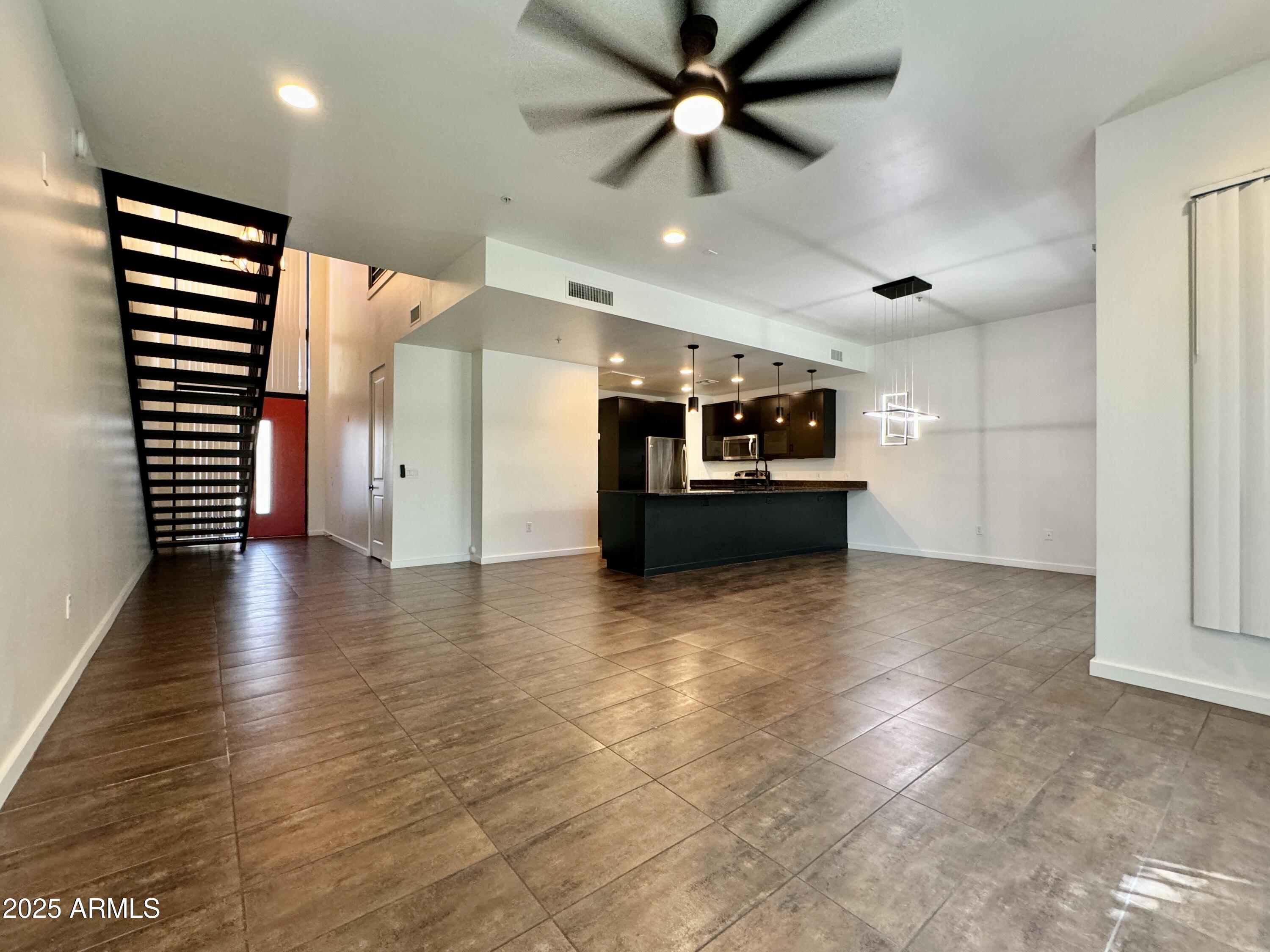 4230 North 21st Street, Unit 12 Phoenix, AZ 85016 - Photo 5 of 17 a view of a kitchen with a sink and a stove top oven