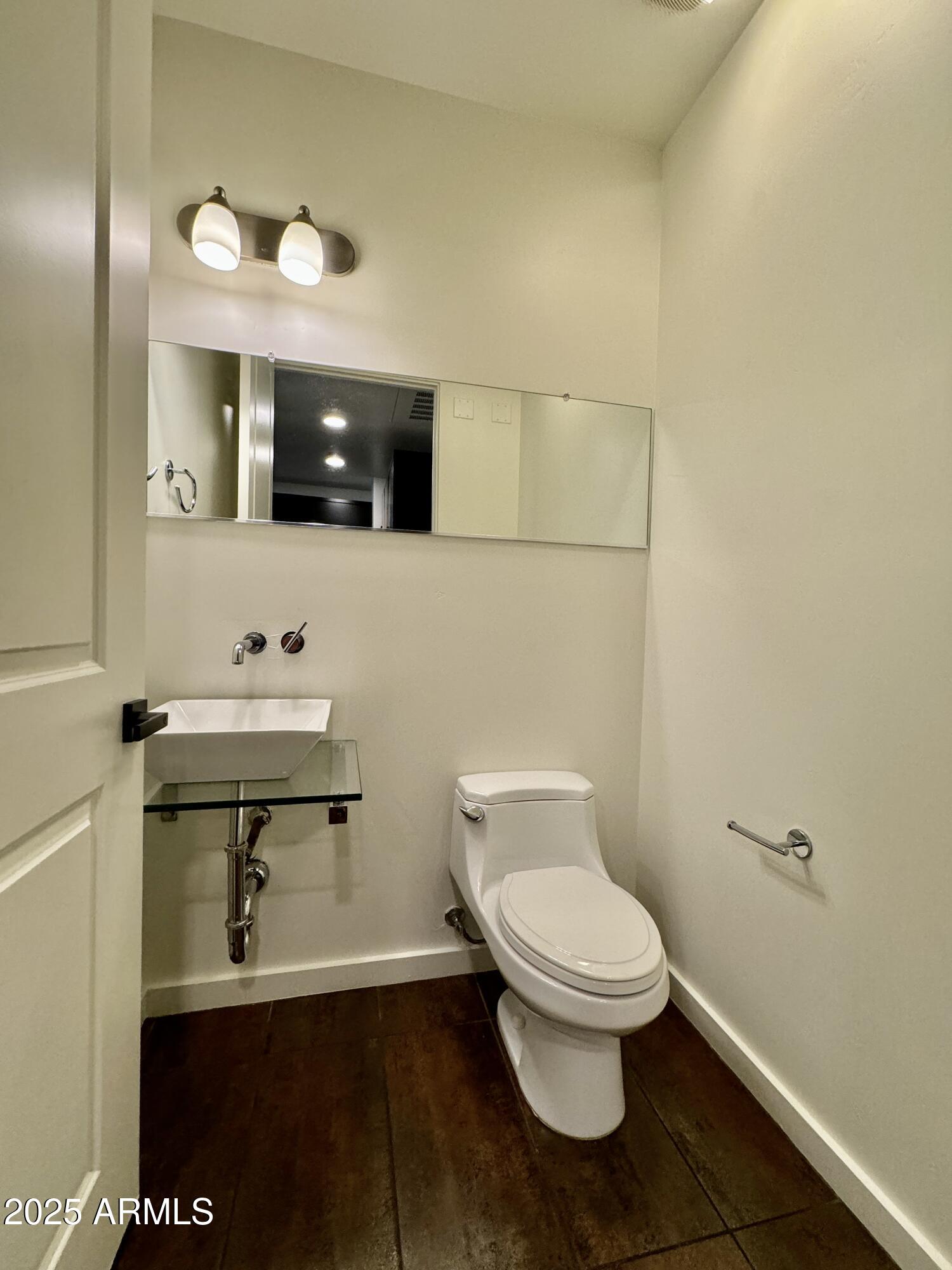 4230 North 21st Street, Unit 12 Phoenix, AZ 85016 - Photo 6 of 17 a bathroom with a toilet a sink and mirror