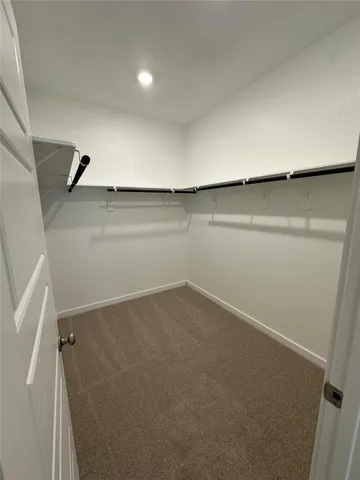 a spacious bathroom with a double vanity sink and a mirror