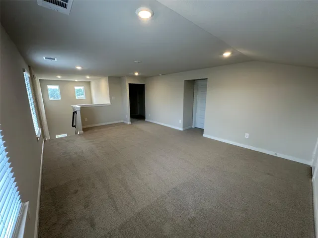a bathroom with a double vanity sink a mirror and a bathtub