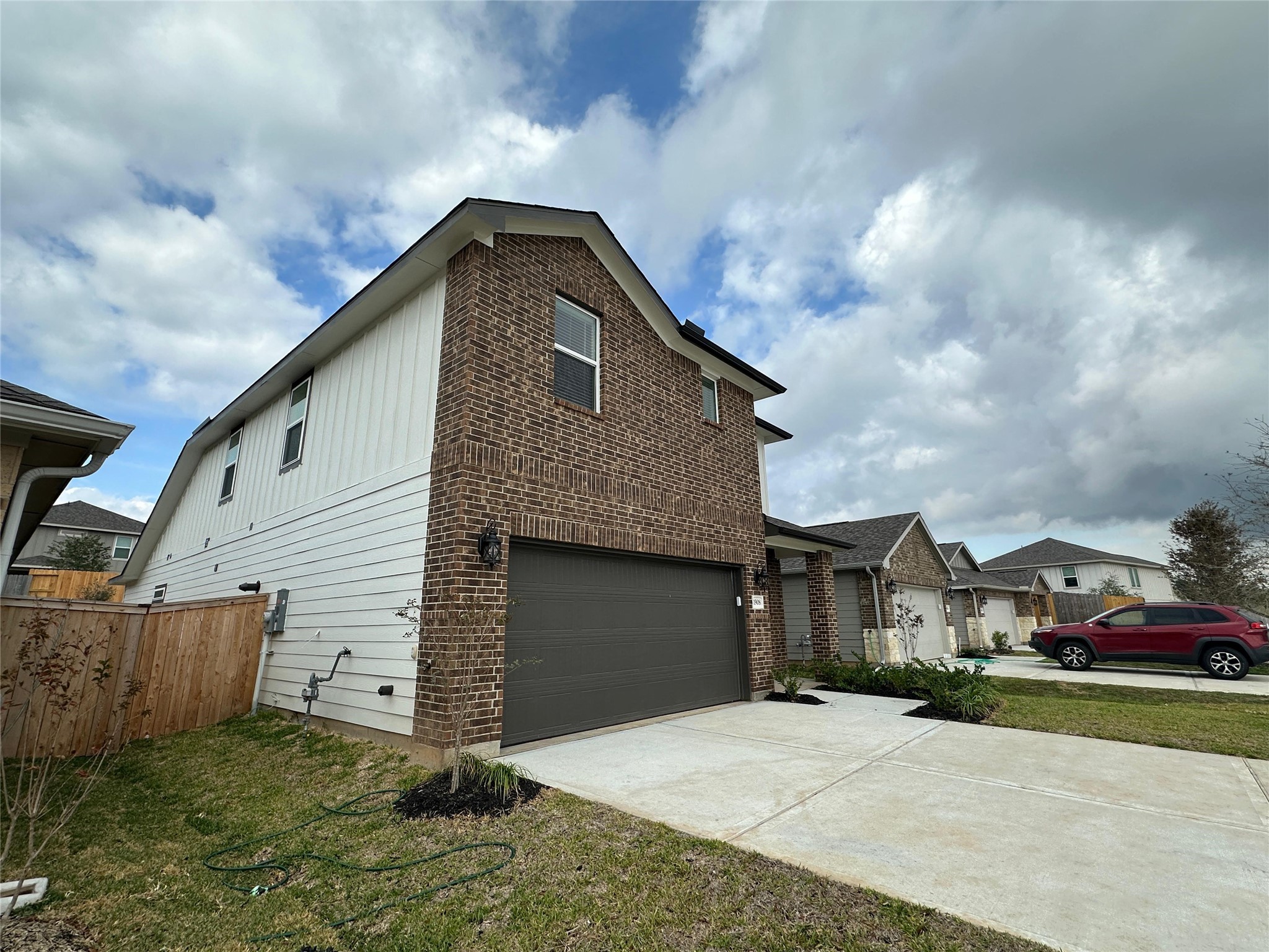 1908 Velvet Oak Lane Conroe, TX 77304 - Photo 2 of 16 a front view of a house with a yard
