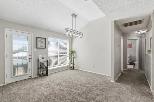 a view of livingroom with furniture and windows