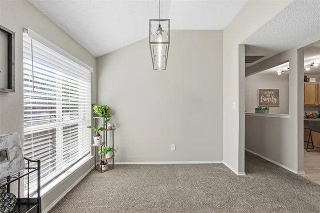 a view of a kitchen center island and stainless steel appliances