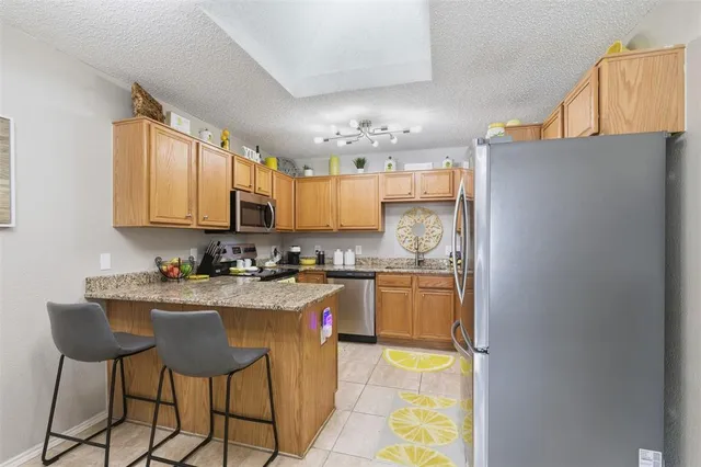 a kitchen with a sink a stove and cabinets