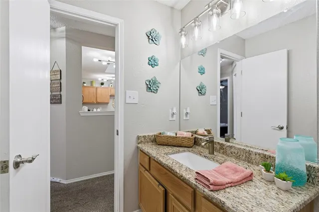 a bedroom with furniture a rug and a window
