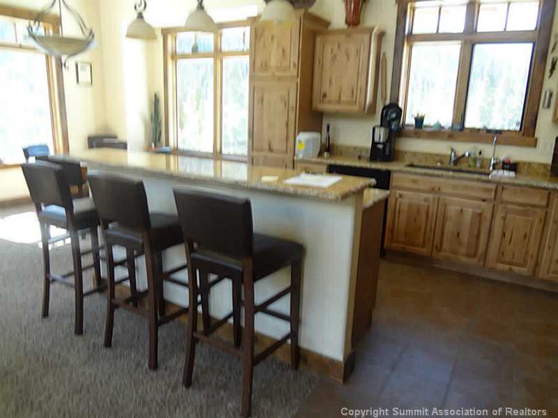 6895 Montezuma Road Dillon, CO 80435 - Photo 3 of 21 Kitchen. Beautiful knotty alder cabinets, crushed granite sink, beautiful granite
