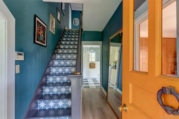 a bathroom with a bathtub and a window