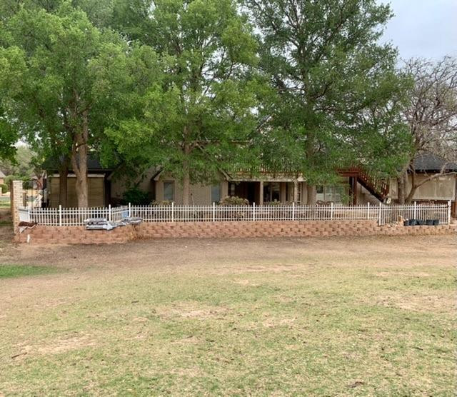 4615 94th Street Lubbock, TX 79424 - Photo 2 of 2 a backyard of a house with table and chairs