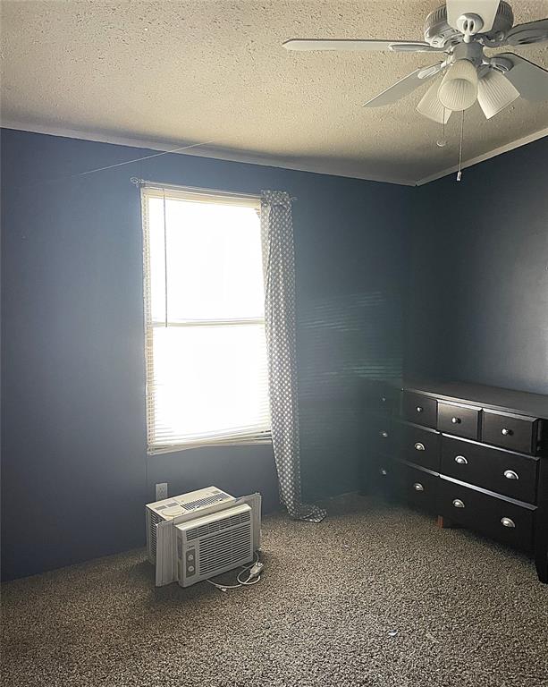 105 Apache Road Brownwood, TX 76801 - Photo 19 of 24 an empty room with a window and a ceiling fan