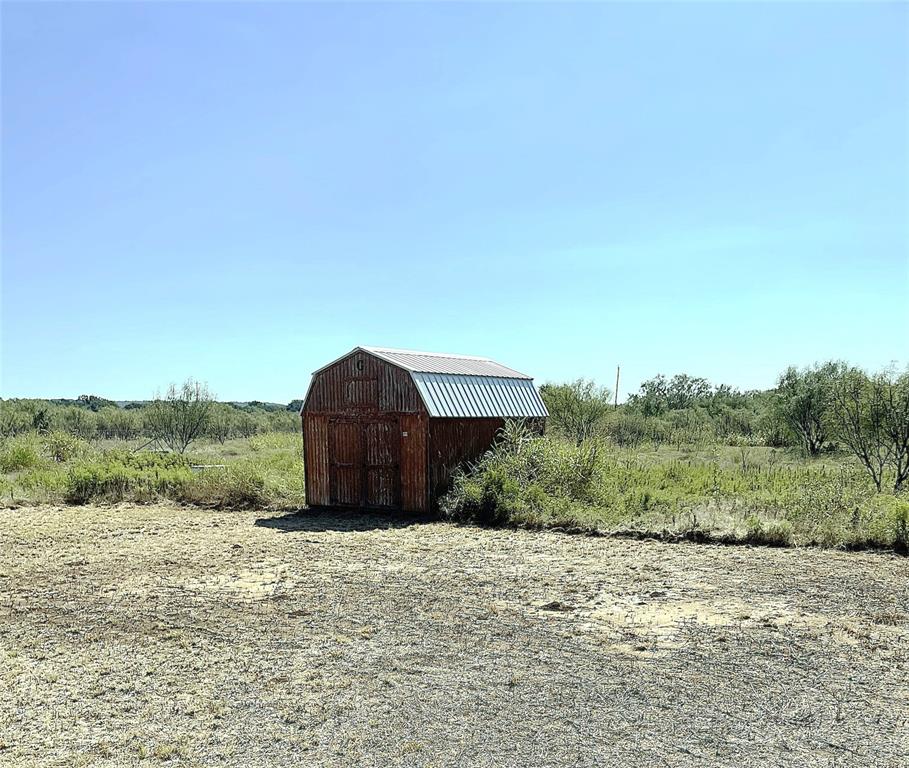 105 Apache Road Brownwood, TX 76801 - Photo 21 of 24 a view of a dry yard with large trees