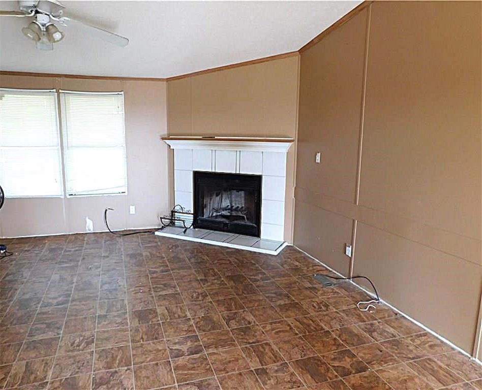 105 Apache Road Brownwood, TX 76801 - Photo 4 of 24 a view of empty room with a fireplace