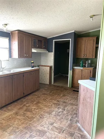 a view of a kitchen with a sink