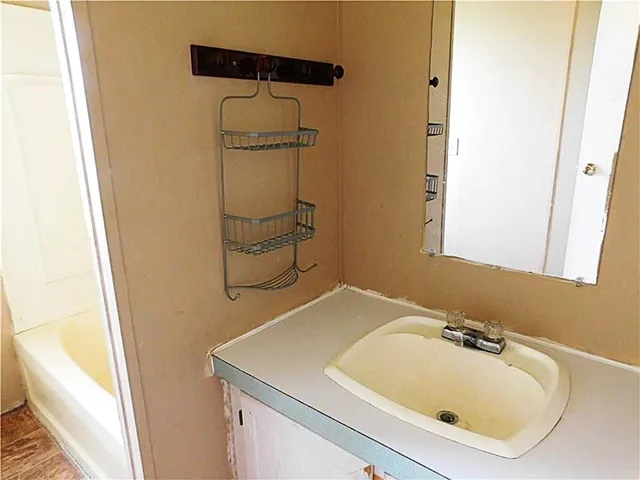 a bathroom with a sink and a tub