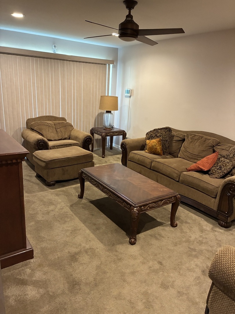 12346 South Indiana Avenue Chicago, IL 60628 - Photo 5 of 14 a living room with furniture and a flat screen tv